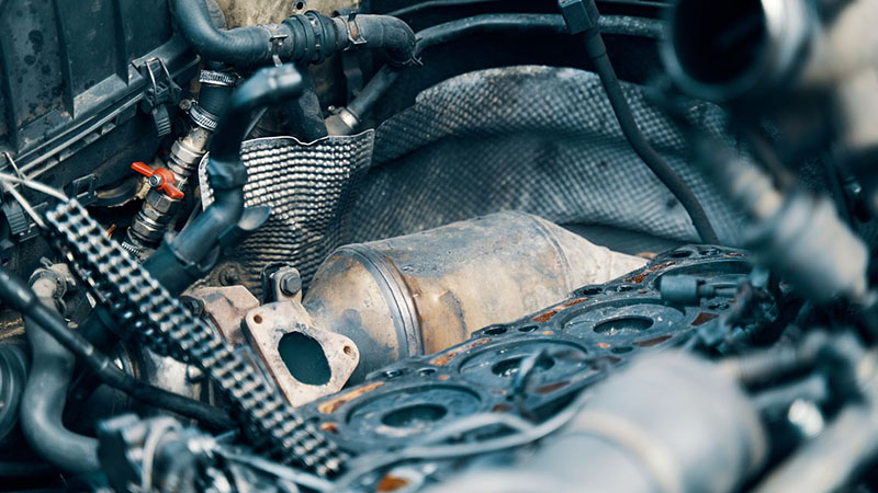 Diesel particulate filter (DPF) under the hood of a diesel engine.