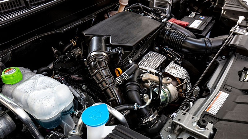 Modern mild hybrid vehicle engine with electrified powertrain components.