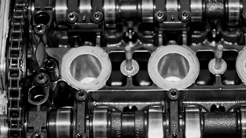 Close-up of cylinder head showing valves and combustion chamber design.