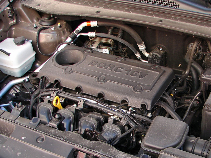 Close-up of a Kia Sportage engine under the hood.