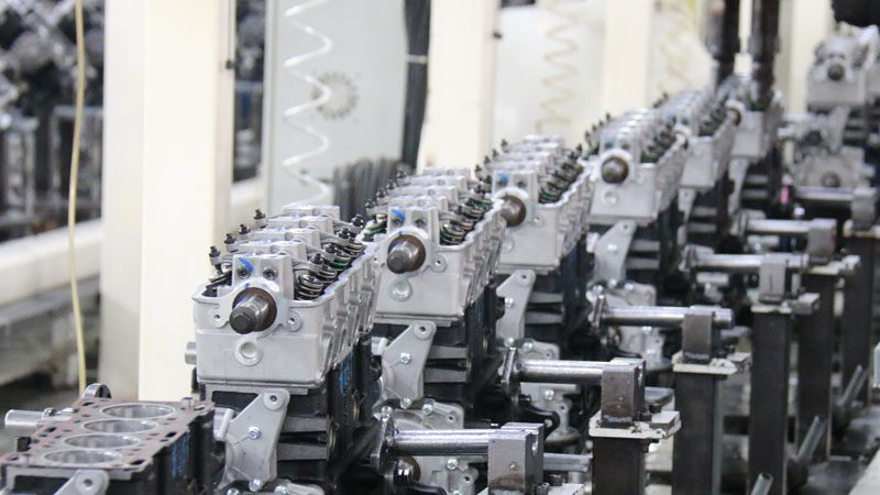 Auto engine assembly on the production line at Nanjing Woda Auto Technology Co., Ltd. factory.