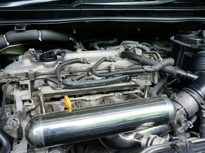 Close-up of engine replacement during installation in a workshop.