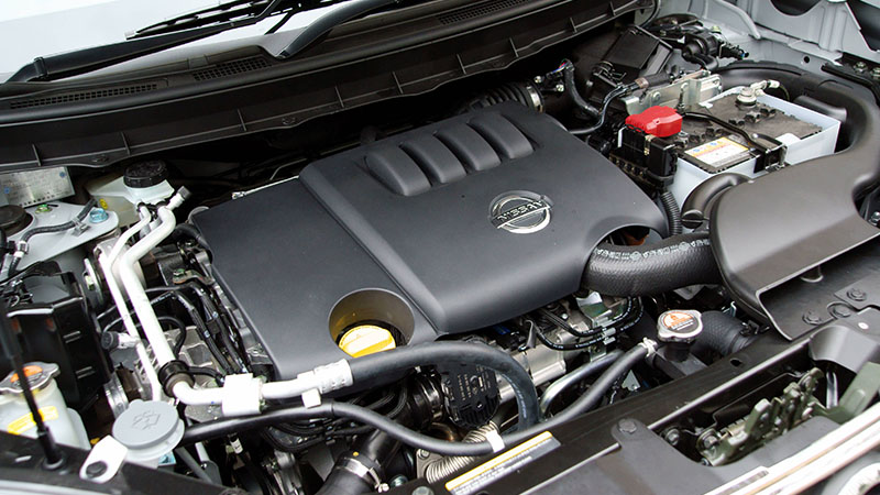 Close-up of Nissan engine bay showing engine components and layout.