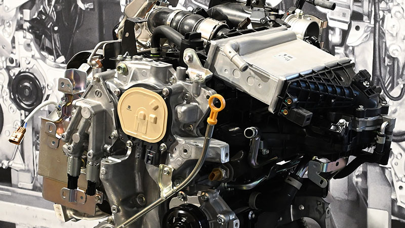 Close-up of Nissan KR15DDT 1.5L VC-Turbo engine showing key components.