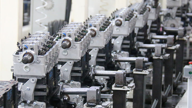 Auto engine assembly line at Woda Auto factory showing multiple engines.