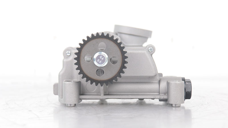 Close-up of an automotive oil pump with simple background.