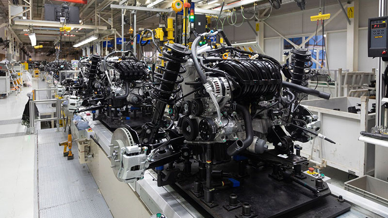 Automated vehicle assembly line illustrating industrial manufacturing and production efficiency.