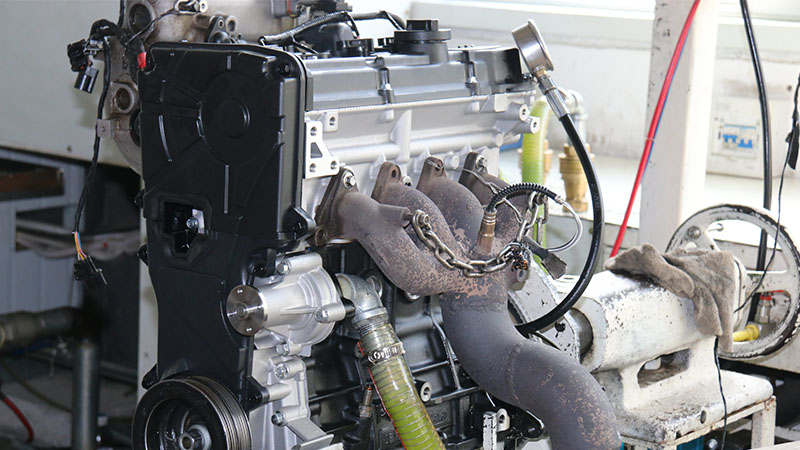 Newly assembled engine undergoing testing after production.