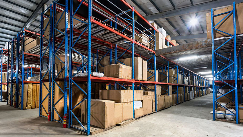 Warehouse shelves with replacement engine stock ready for distribution.