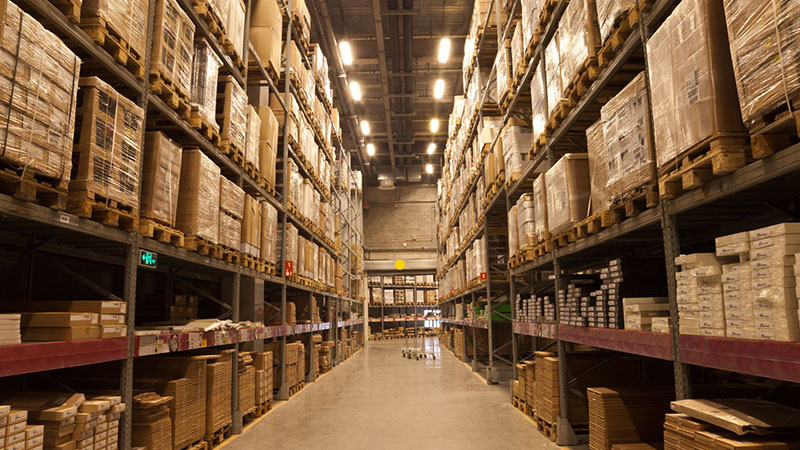Warehouse shelves used for organized engine parts and inventory storage.