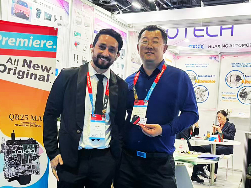 Woda sales manager with a customer at an automotive parts trade show
