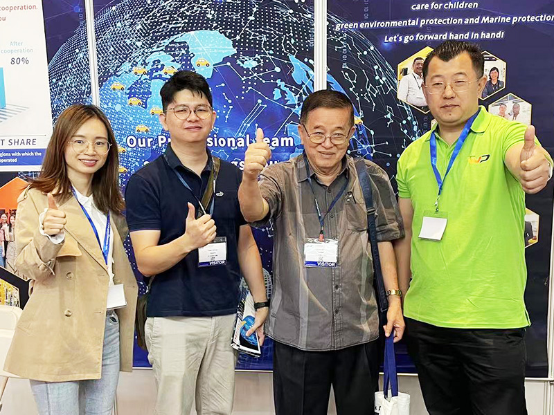 Woda team meeting customers at an auto parts exhibition