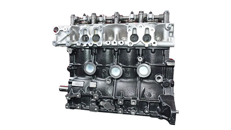 Back view of a Toyota 22R bare engine highlighting rear block and mounting points.