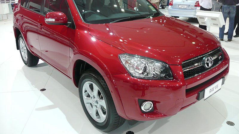 Close-up of the front view of a red Toyota RAV4.
