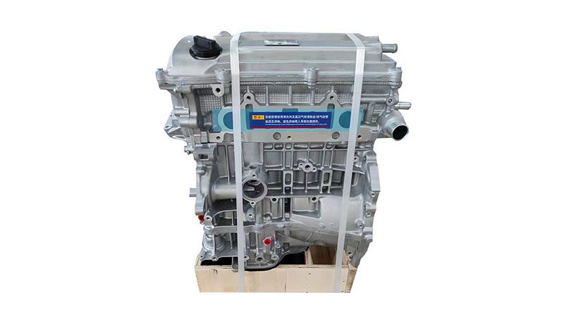 Front view of a bare Toyota 2AZ-FE engine.