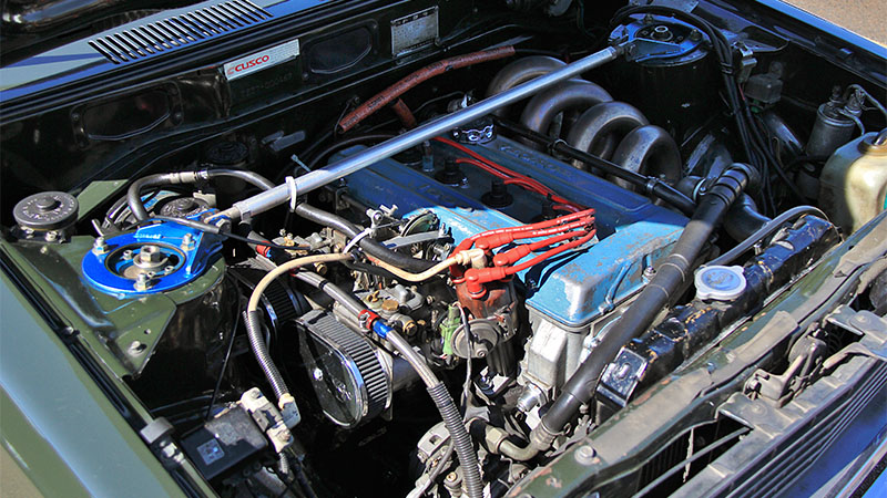 Engine bay of a Toyota Corolla Levin with visible performance engine components and intake system.