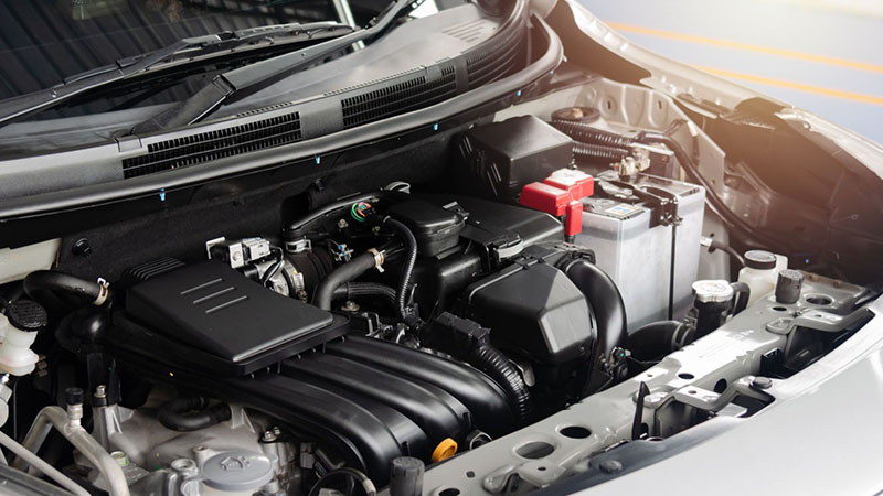 Modern car engine detail showing components, wiring, and precision engineering design.