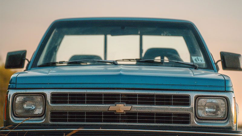 Blue vintage truck in the sun.