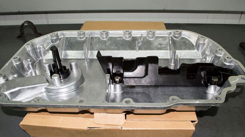 Close-up of a new internal combustion engine oil sump