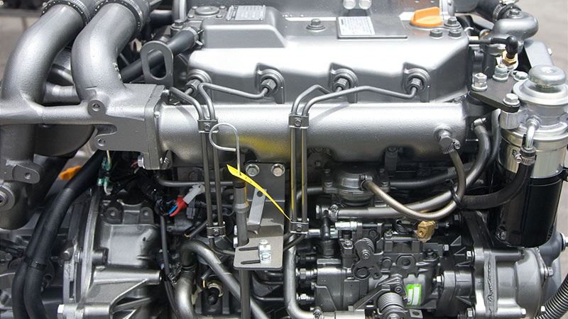 Close-up view of a marine diesel engine showing detailed mechanical components.