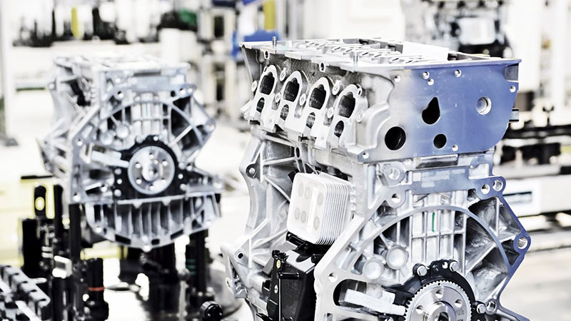Close-up of assembled auto engines during the engine manufacturing process at a factory.