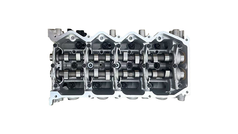 Top view of a Nissan YD25 engine showing cylinder head and valve cover details.