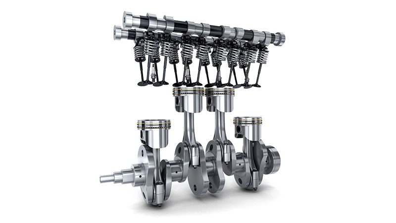 Crankshaft, camshaft, and pistons assembled, showing their relationship within an internal combustion engine.